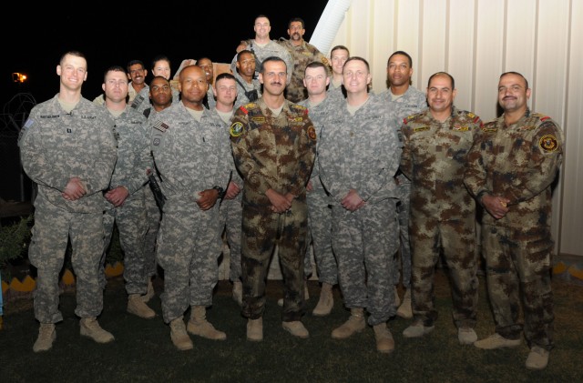 Iraqi Soldiers and U.S. Paratroopers share one last meal together