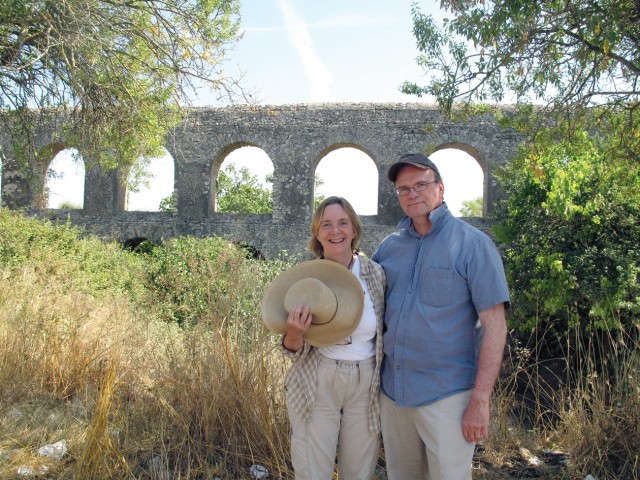 Drs. Jack and Laurie Rush stand in front of an old Roman aqueduct in the ancient city of Tarquinia earlier this year. During her husband's visit, Rush said they took day trips in and around Rome while renting a country house in the mountains of a reg...