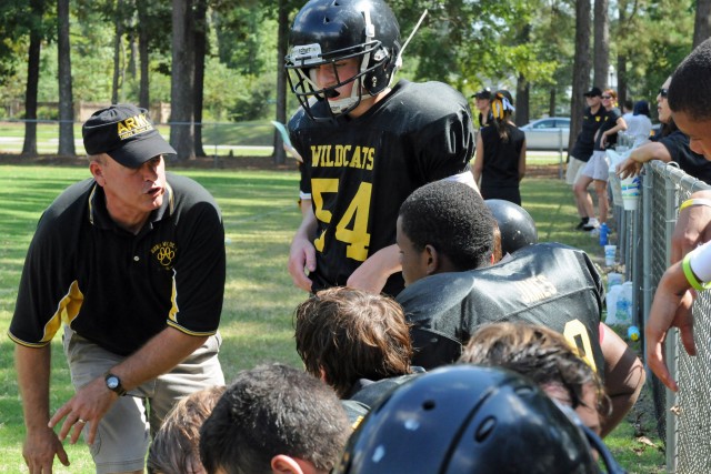 Soldier a truck driver by day, volunteer coach by night