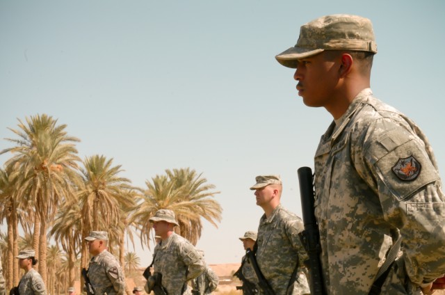 U.S. service members reenlist at Iraqi oasis