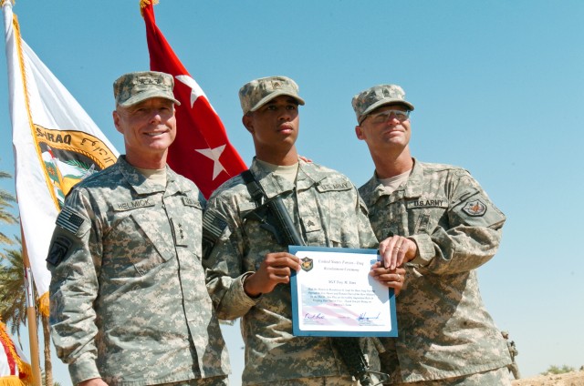 U.S. service members reenlist at Iraqi oasis