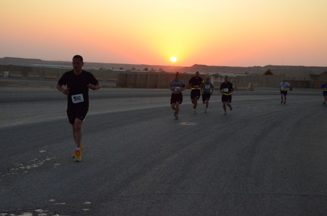 Service members deployed to Iraq shadow run the Army Ten-miler