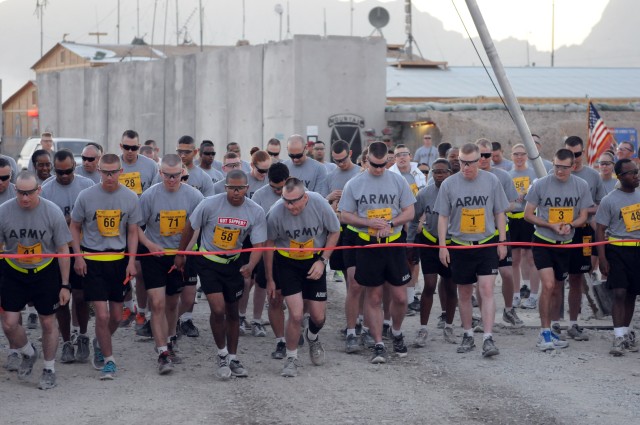 Runners start the Spartan shadow run of the Army 10-Miler at FOB Pasab