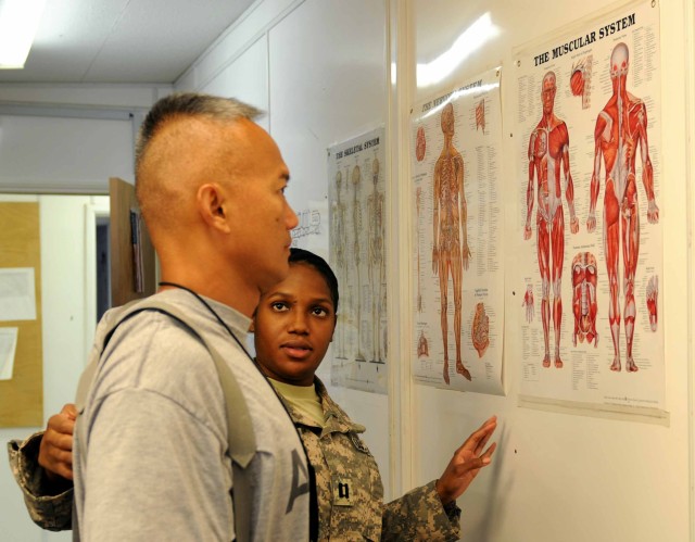 Physical therapy taking away Soldiers' pain 1 of 3