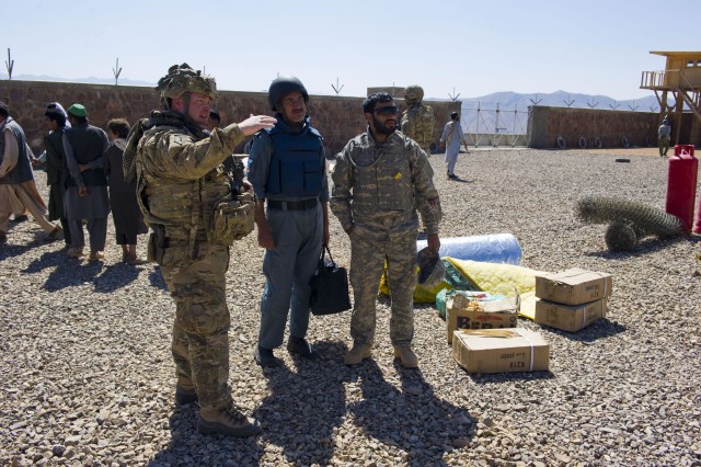 U.S. Army mentor Maj. David Steele discusses the project with Lt. Col. Khan