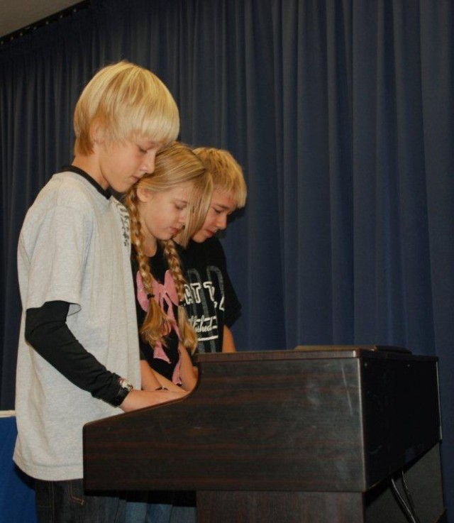 Baines Trio play with crossed hands