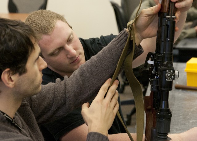 Engineers examine weapon