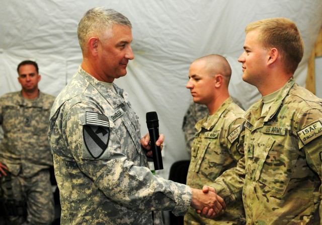 Sgt. Maj. of the Army presents coins to Arctic Wolves Soldiers