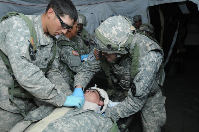Combat aid station displays medical skills during "controlled chaos"