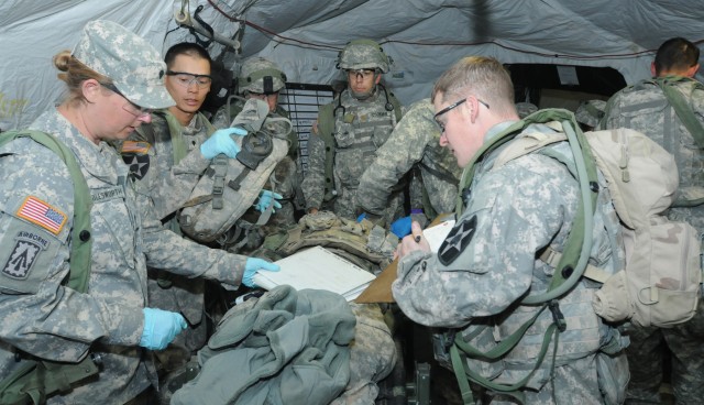 Combat aid station displays medical skills during "controlled chaos"