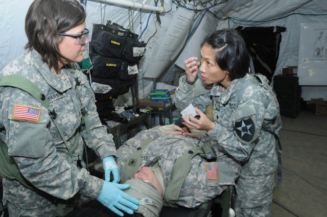 Combat aid station displays medical skills during "controlled chaos"