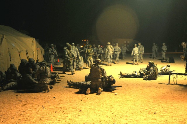 Combat aid station displays medical skills during "controlled chaos"