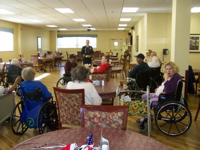 Chaplain (Lt. Col.) Charles Rizer addresses residents of the Rock Island, Ill., Rehabilitation Center