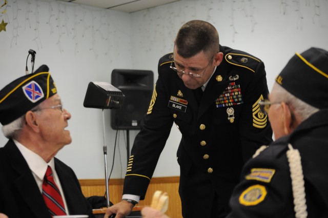 Command Sgt. Maj. Stephen Blake meets with veterans