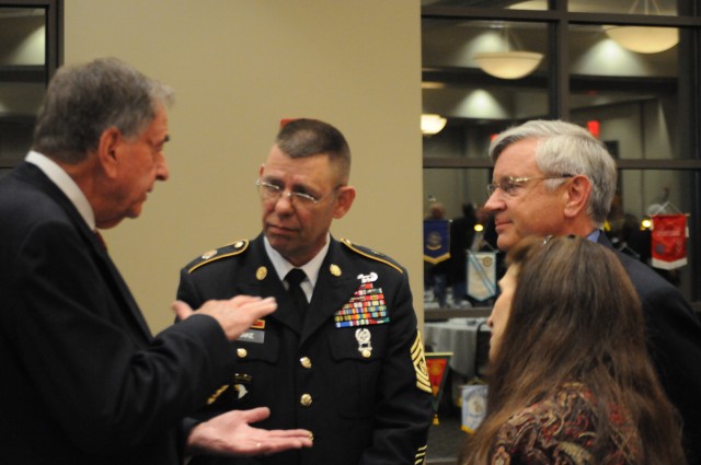 Command Sgt. Maj. Stephen Blake speaks with Honor Flight organizers