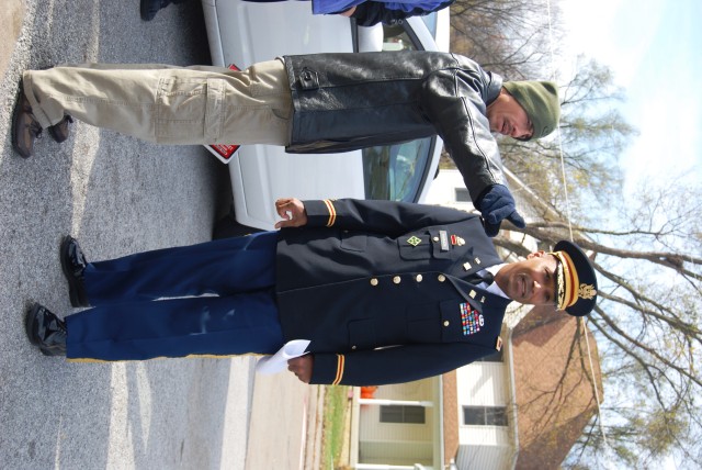 Col. Victor Harmon, ASC, with Navy veteran Brian Munos
