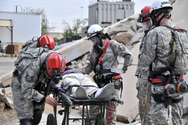 Combat engineers tunnel into leveled buildings to save lives