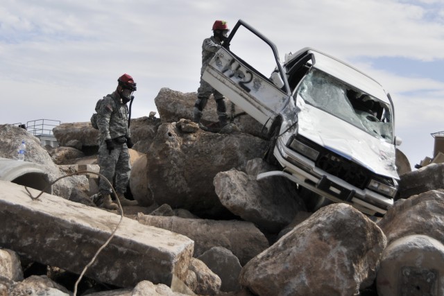 Combat engineers tunnel into leveled buildings to save lives