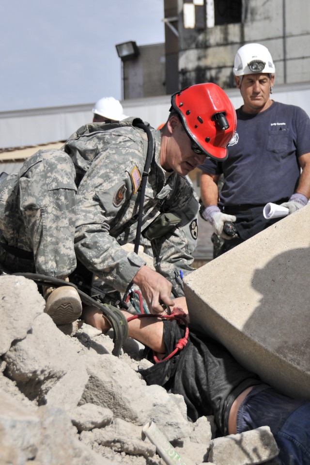 Combat engineers tunnel into leveled buildings to save lives