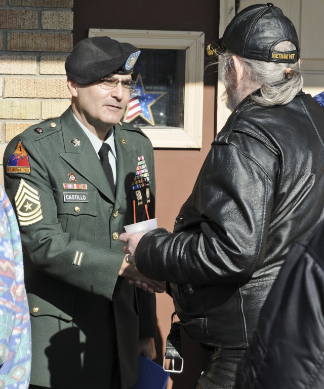 Sgt. Maj. Nicholas Castillo, ASC, meets with a veteran