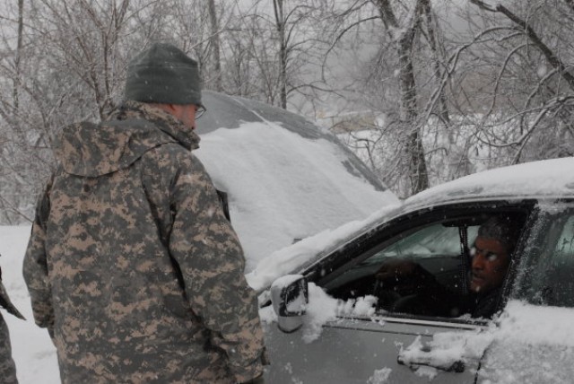 Guard Soldiers rescue motorist stranded in snow