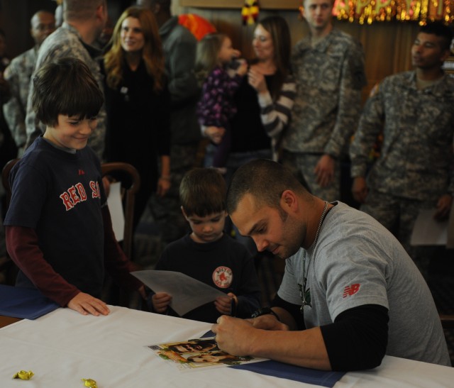 Nick Swisher autographs a photo