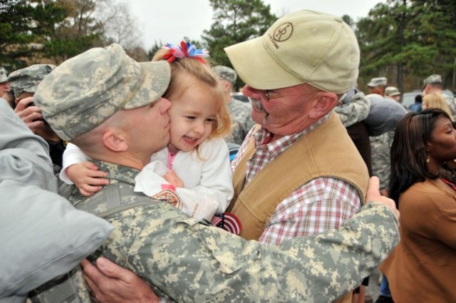Dad hugs daughter