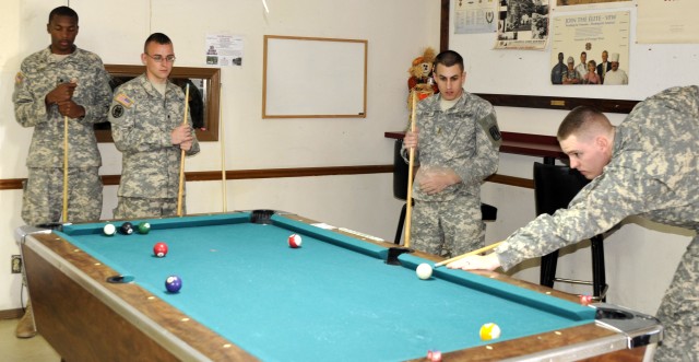 Soldiers relax with a game of pool