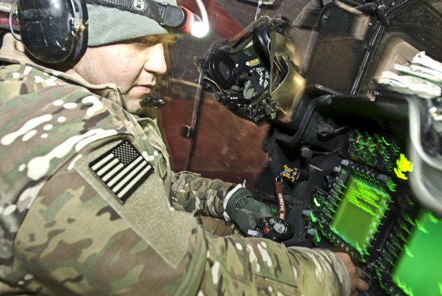 Armament technicians work long nights to keep Apache helicopters in the fight