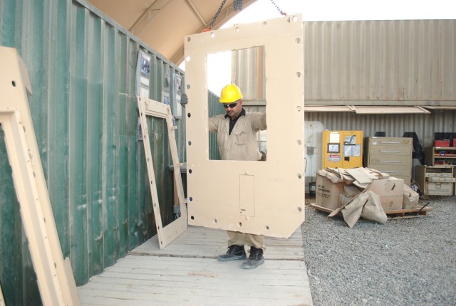 Adding on armor at Camp Arifjan