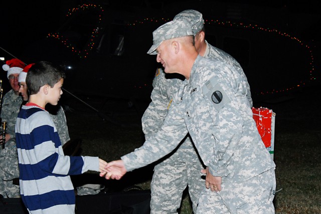 DCG-IMT shakes child's hand at Eustis tree lighting ceremony