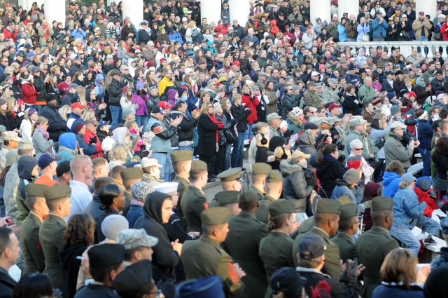 Thousands lay wreaths at nation's cemetery