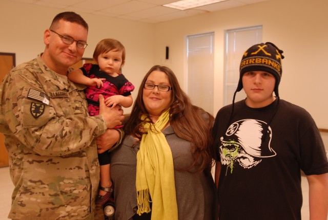 Villalobos family takes photo after welcome home ceremony