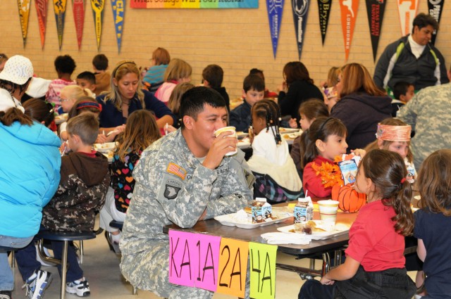 Soldiers serve Thanksgiving dinner to parents, students at Bliss Elementary