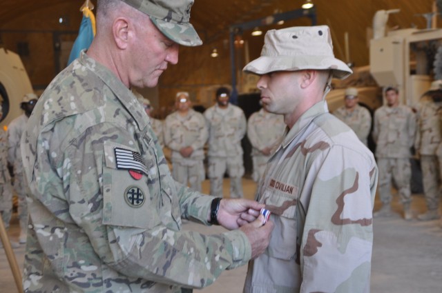 Brig. Gen. Carroll Awards Aaron Ardon the Defense of Freedom Medal