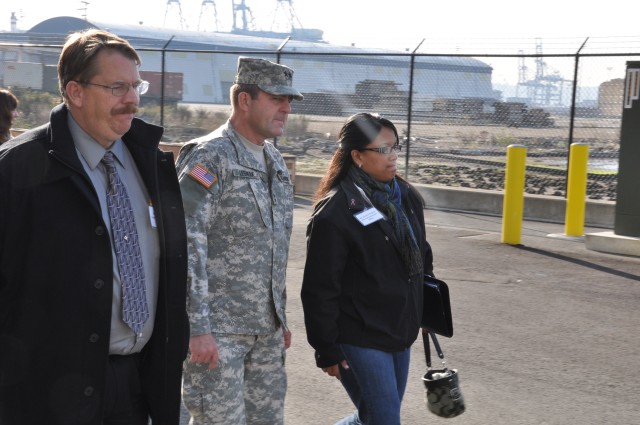 Maj. Gen Glenn Lesniak walks with representatives from Washington