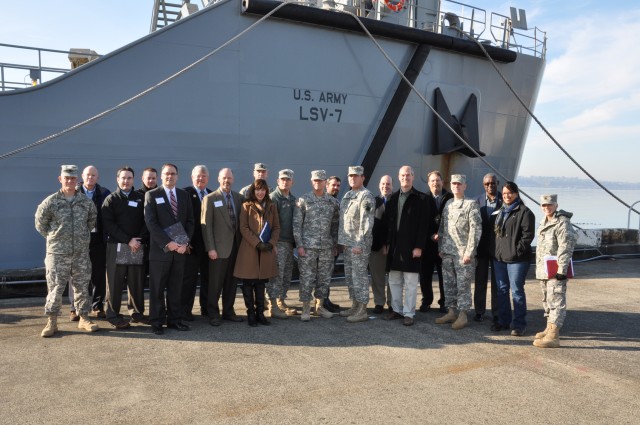 Washington legislators staff view the fleet of Army boats at Pier 23 in Seattle, Wash.