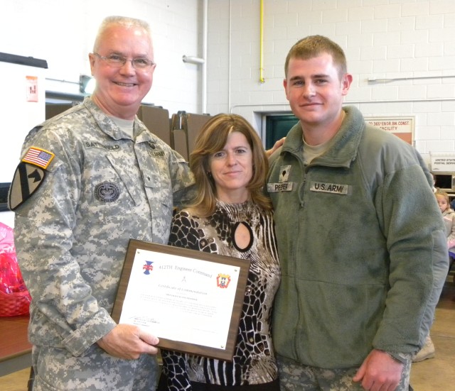 Spc Justin Pfeiffer receives award for selfless service