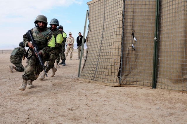 Afghan National Army NCOs demonstrate violence-of-action in clearing a compound