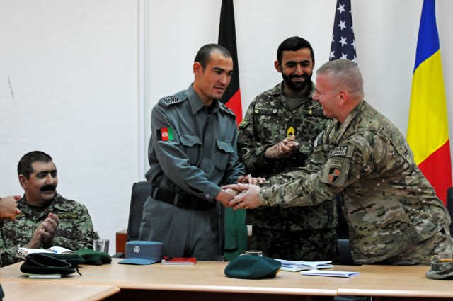 ISAF Joint Command Command Sgt. Maj. Troxell thanks Afghan National Police Command Sgt. Maj. Abdul Zafar