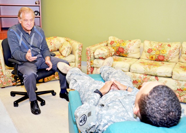 CRDAMC Behavioral Health provider gives progressive relaxation therapy to Soldier
