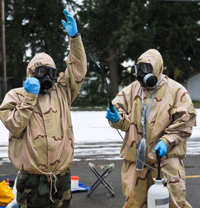 Soldiers enter decontamination line