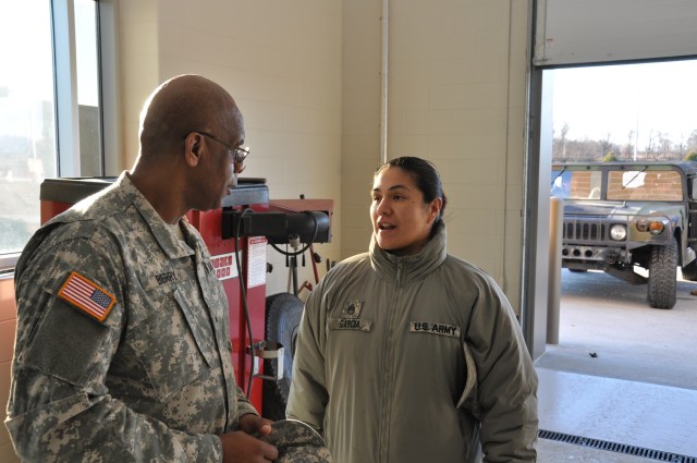 Brig. Gen. Alton Berry talks to Staff Sgt. Garcia about a new maintenance facility