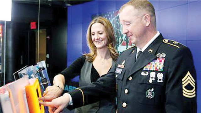 Fort Riley wounded warrior closes NASDAQ in New York