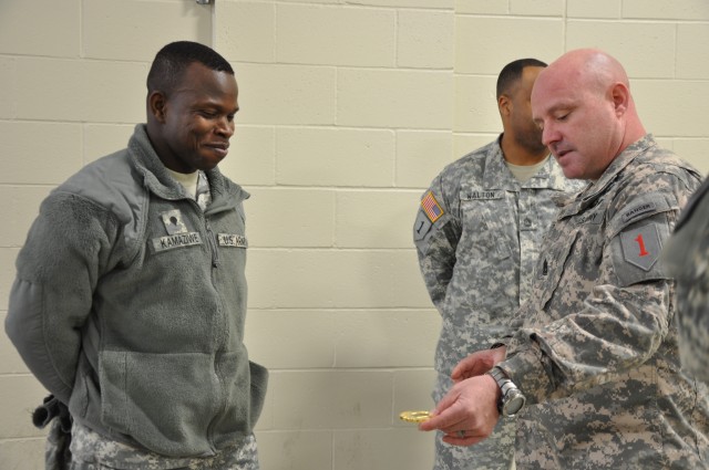 1st ID CSM presents coin of excellence to 4th MEB Soldier