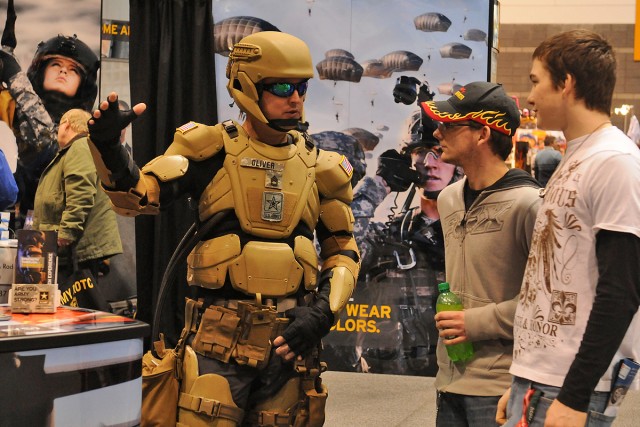 Soldier of the future, Sgt. 1st Class Matthew Oliver silently engaged crowds near the vehicle of the future