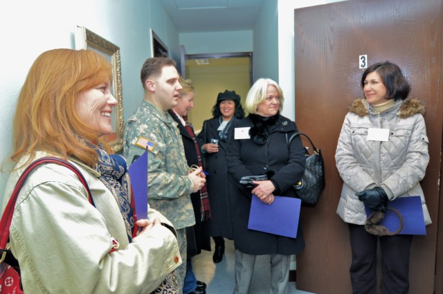 Honored guests observe stork's nest renovations