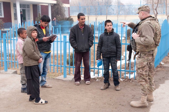 Corps of Engineers workers collect and distribute winter clothes to Kabul orphans