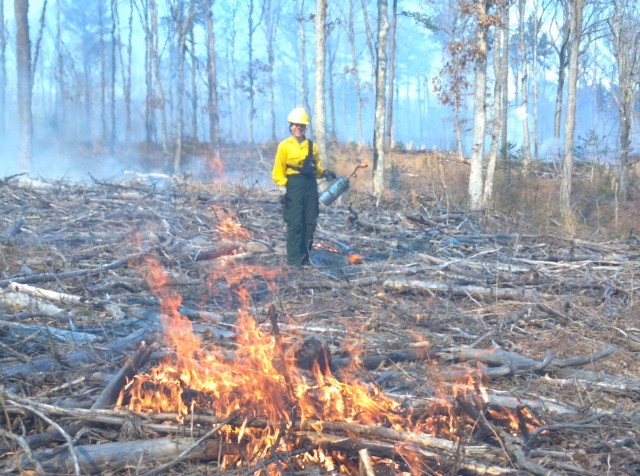 Beth Cantrell of the forestry branch ignites a portion of a training area on Fort A.P. Hill during a prescribed burn Feb. 28.