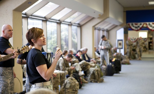 The Volunteers perform for deploying troops